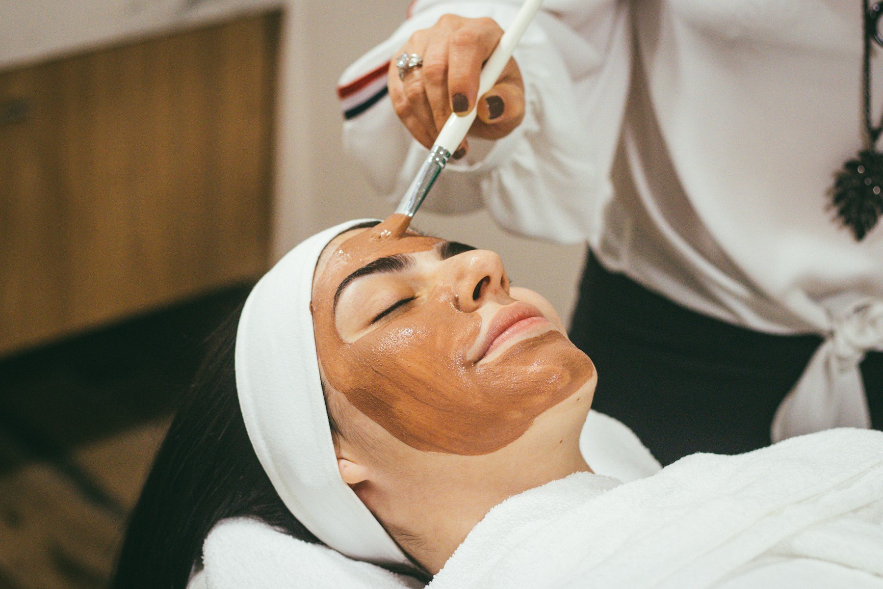 Facial mask application at a spa